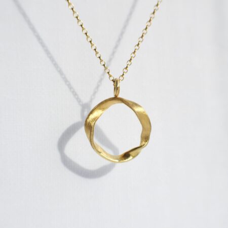 Statement gold ripple ribbon pendant necklace