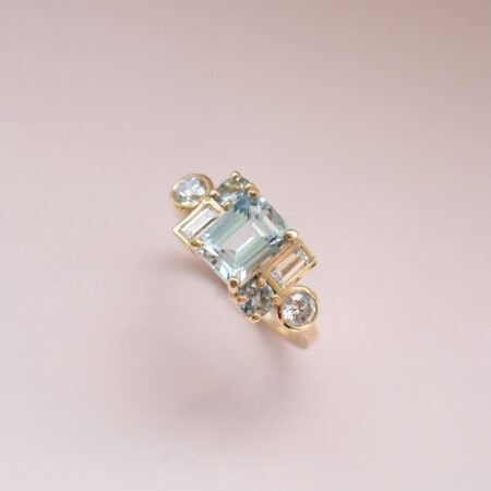 Elegant aquamarine and diamond and gold geometric cluster ring